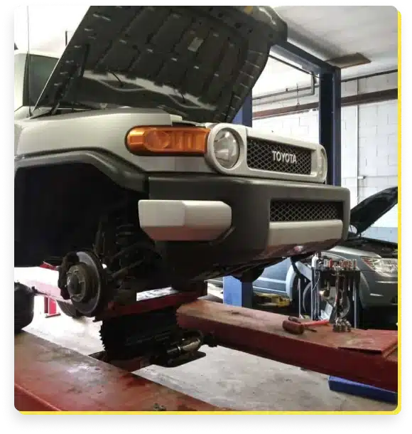 a car on a lift in a garage