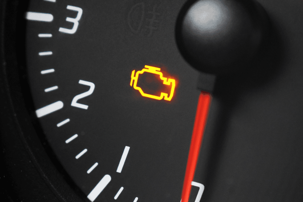 Check engine light, auto repair in Lansing, MI by Jerry’s Automotive. Image of an illuminated malfunction indicator lamp on a vehicle dashboard, signaling the need for professional engine diagnostics and repair.