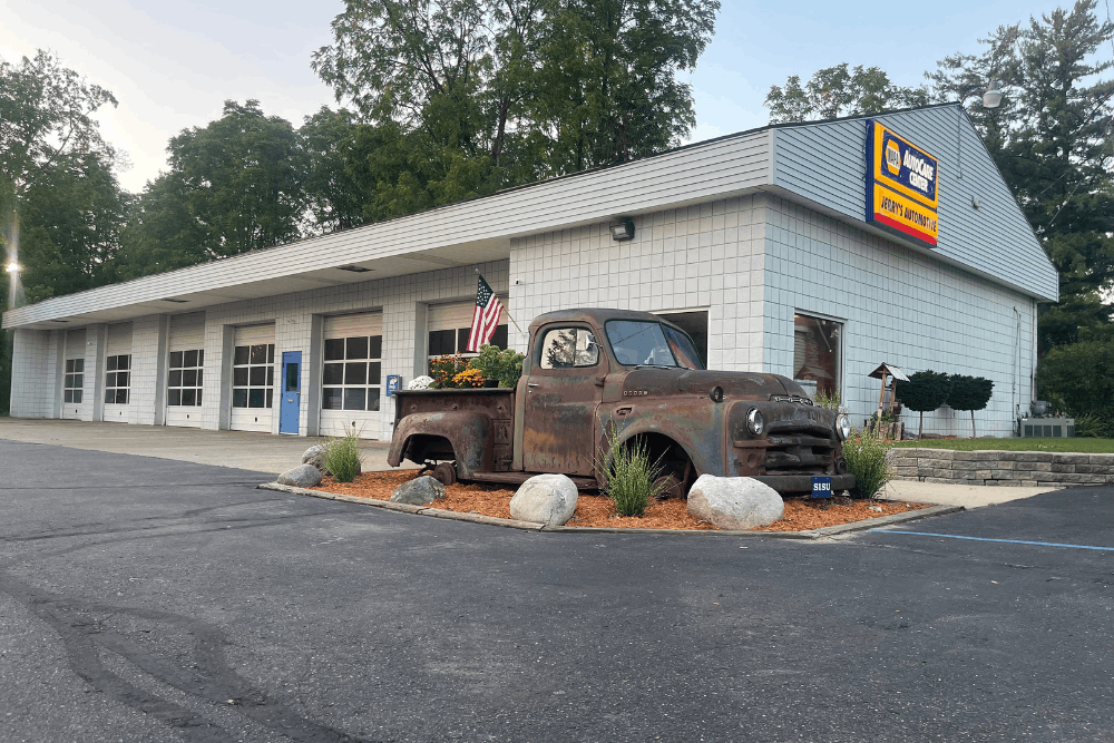 Family-owned auto shop in Lansing, MI at Jerry’s Automotive. Image of a clean, welcoming shop exterior with a vintage pickup display, highlighting trusted, family-owned service, reliable repairs, and a commitment to the local community.